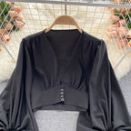 Deep V-neck buttoned short puff sleeve shirt
