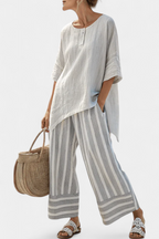Fiorella – elegant asymmetric blouse and striped trousers