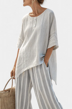 Fiorella – elegant asymmetric blouse and striped trousers