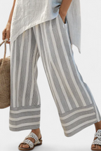 Fiorella – elegant asymmetric blouse and striped trousers