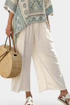 Annalisa – comfortable printed blouse and white wide-leg trousers