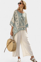 Annalisa – comfortable printed blouse and white wide-leg trousers
