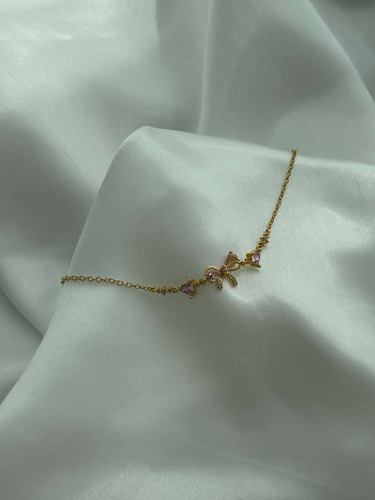 Aetria Zirconia Bow Detail Chain Bracelet