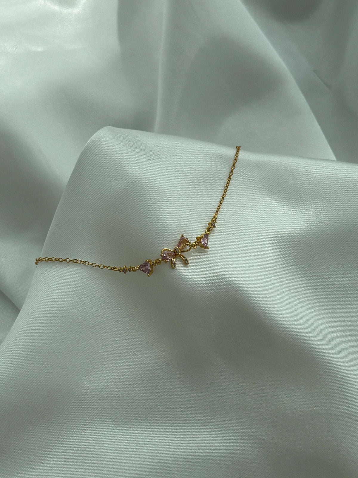 Aetria Zirconia Bow Detail Chain Bracelet
